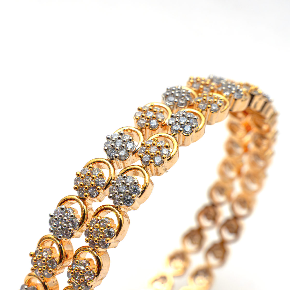Daisy Zirconia Stone Studded bangles in dual-tone gold and silver plated finish with cubic zirconia (CZ) stones closeup view